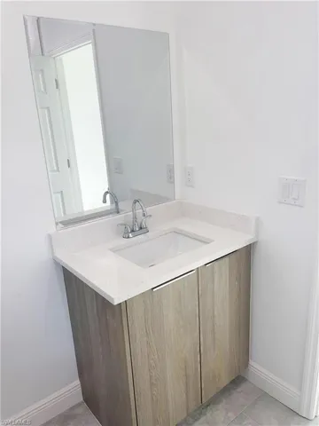 Bathroom featuring vanity and tile patterned floors