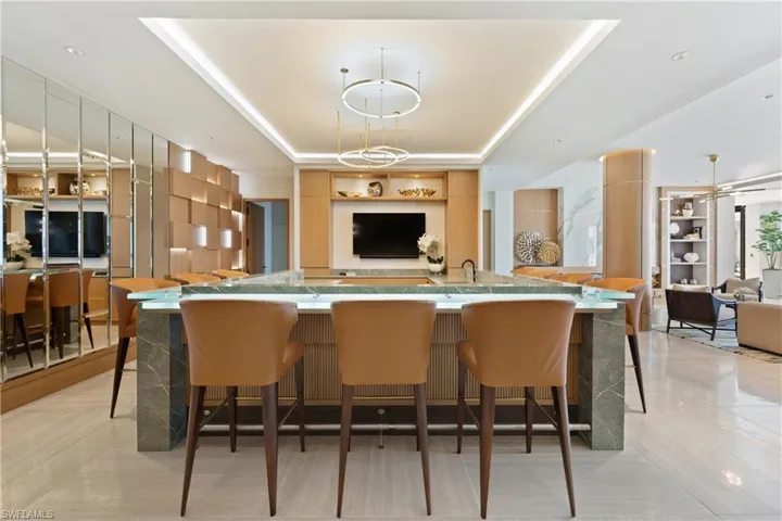 Kitchen with open floor plan and a breakfast bar