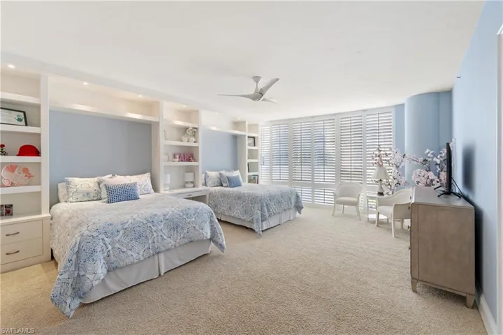 Bedroom with carpet and ceiling fan