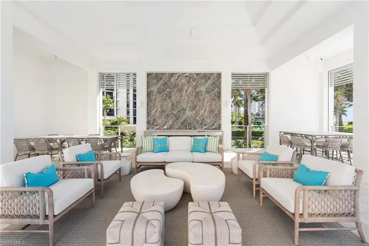 View of patio / terrace with outdoor dining space, an outdoor living space, and a sunroom
