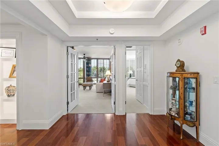 Foyer entrance featuring baseboards and wood-type flooring