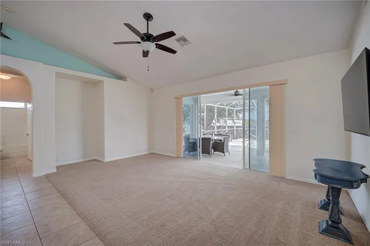 Living room with access to pool