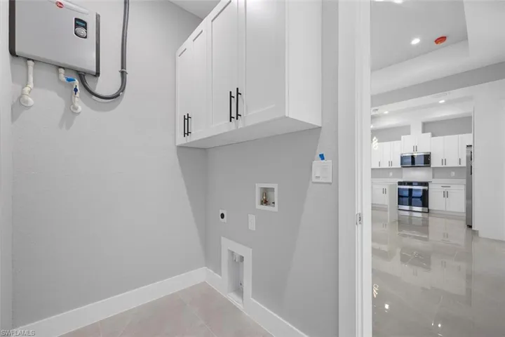 Bathroom with tile patterned flooring and vanity