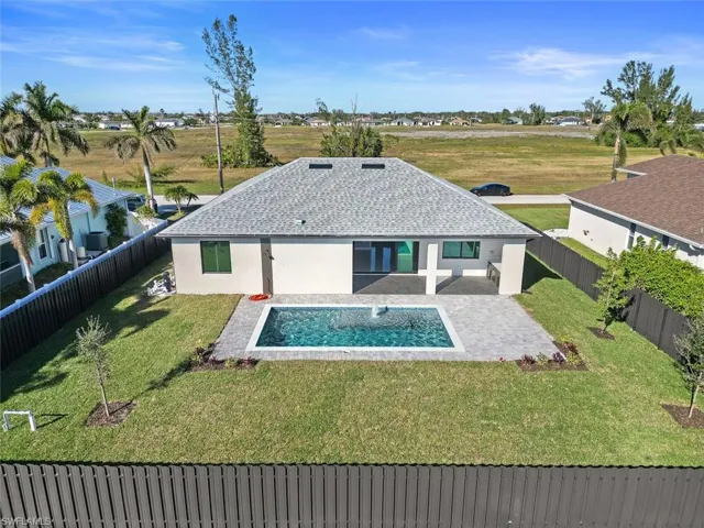 Rear view of property featuring a patio