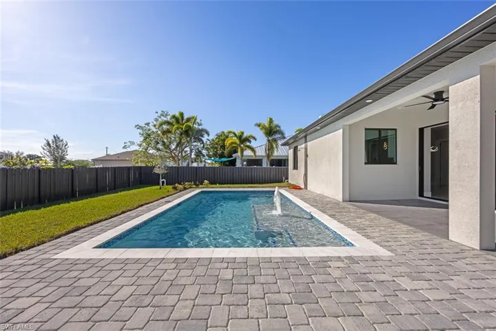 View of patio featuring an outdoor kitchen, wine cooler, and sink