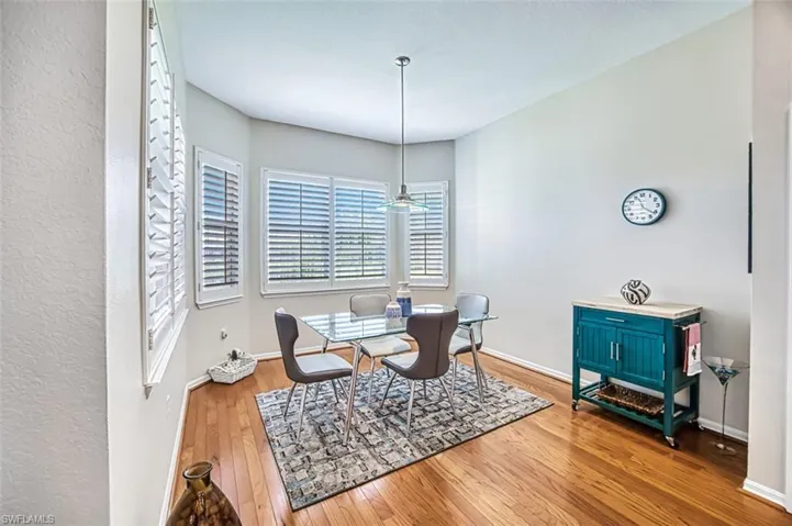 Dining room with hardwood / wood-style flooring