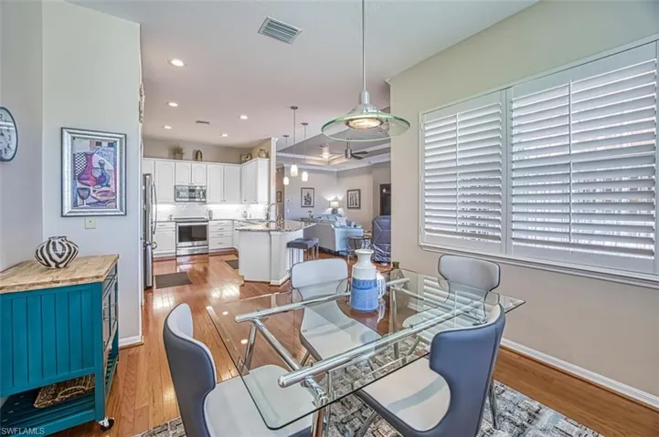 Dining area featuring sink and light hardwood / wood-style floors