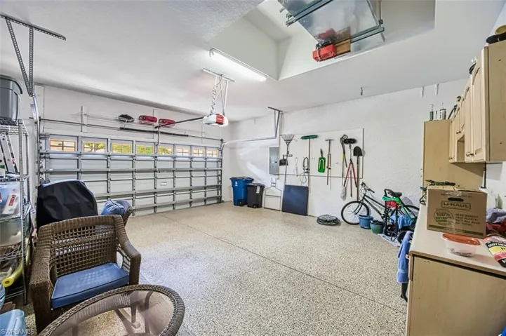 Garage with a garage door opener and electric panel