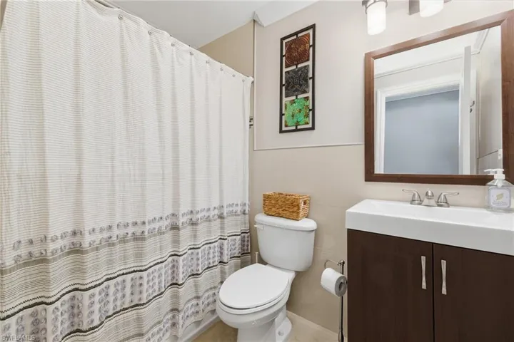 Bathroom with vanity and a shower with shower curtain