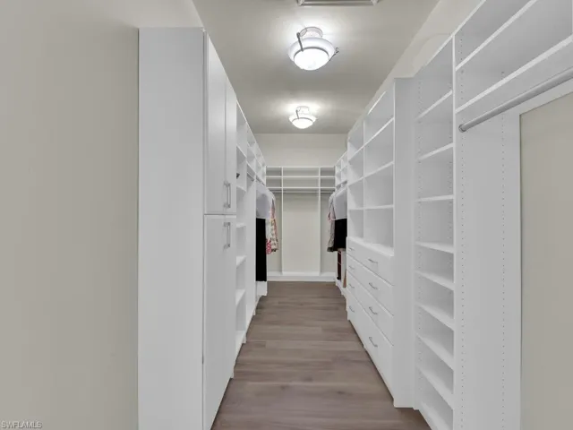 Walk in closet with built-in shelves