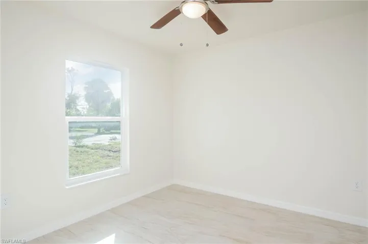 Empty room featuring ceiling fan