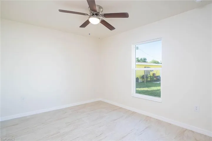 Empty room featuring ceiling fan
