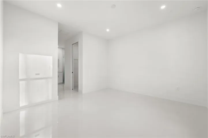 Spare room with recessed lighting and finished concrete floors