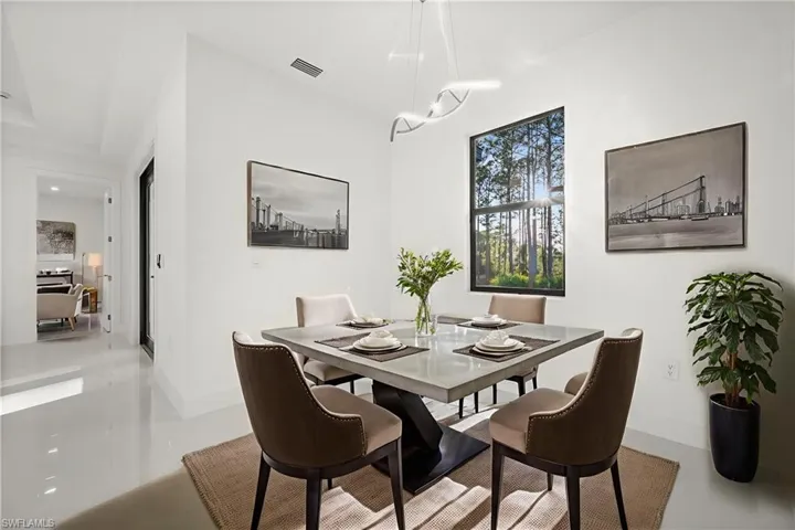 Dining space featuring finished concrete flooring