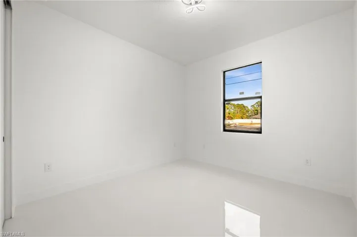 Unfurnished room with baseboards