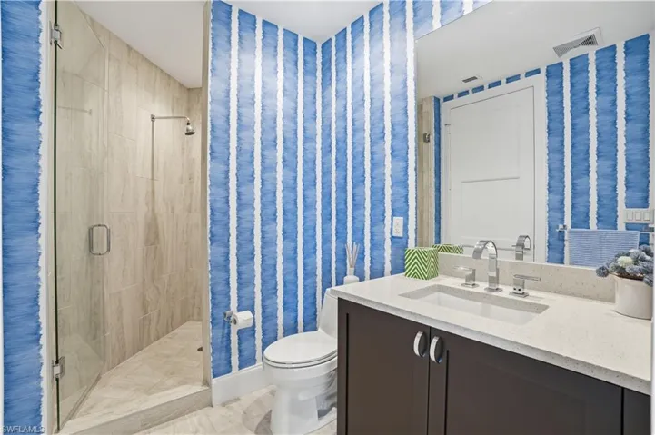 Guest bathroom with large walk-in shower.