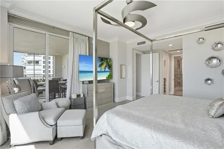 The primary bedroom suite boasts lanai access and 2 large closets with custom built-ins.