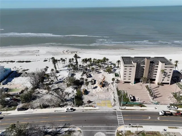 Aerial view of property's location featuring a large body of water