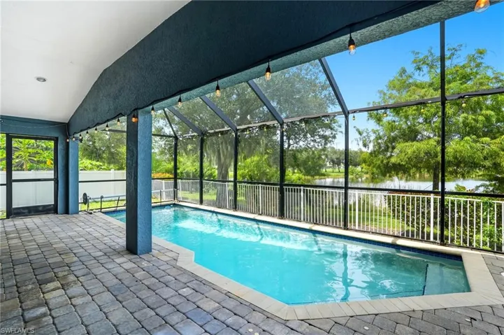 Pool with views of pond with water feature and Jim Jeffers in the distance.