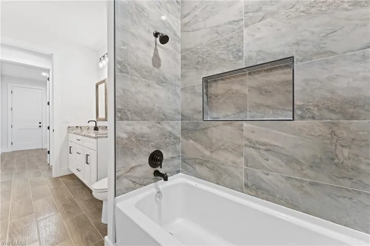 Full bathroom with vanity and shower / bath combination