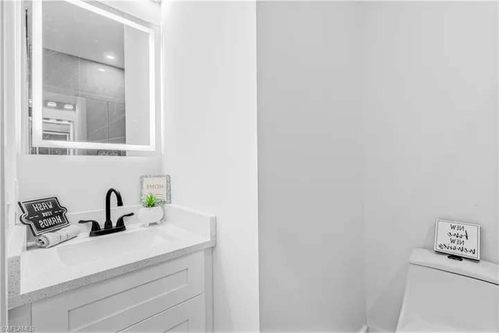 Bathroom featuring vanity and toilet