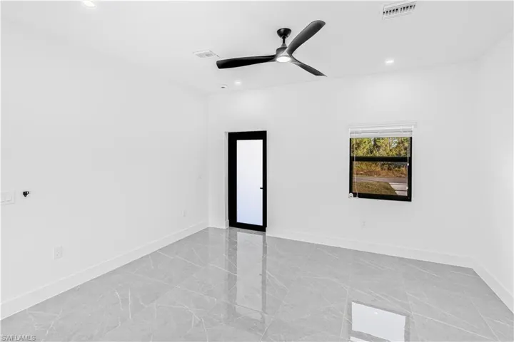 Unfurnished room with recessed lighting, a ceiling fan, and light marble finish floors