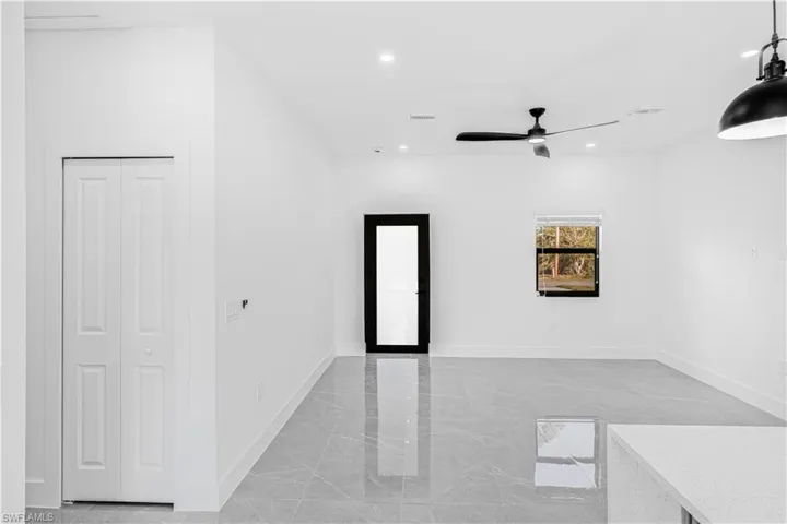 Unfurnished room featuring recessed lighting, ceiling fan, and light marble finish floors