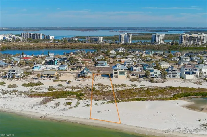 Drone / aerial view with a beach view and a water view