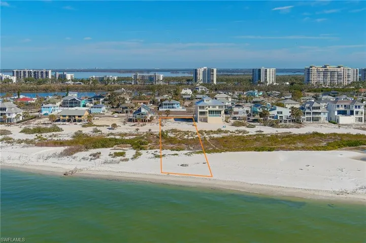 Drone / aerial view featuring a view of the beach and a water view