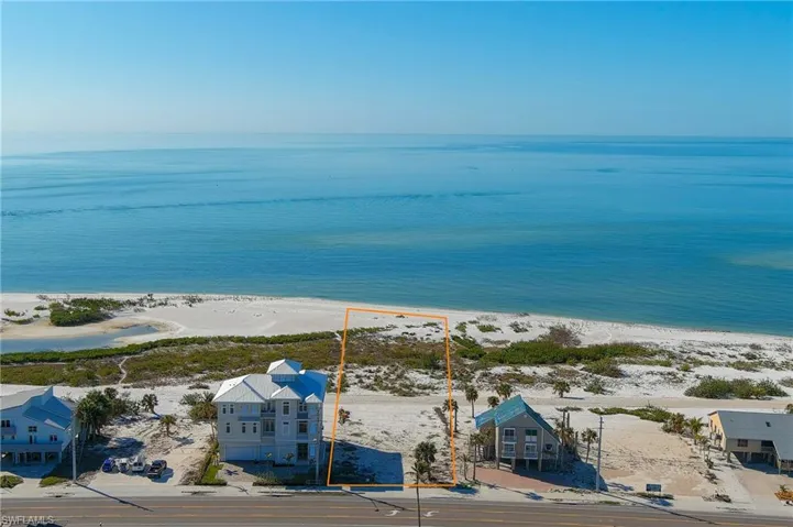 Bird's eye view featuring a water view and a view of the beach