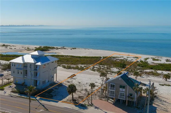Bird's eye view with a water view and a beach view