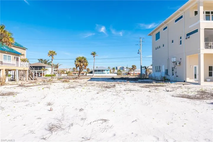 View of yard from lot, miles of beach to walk.