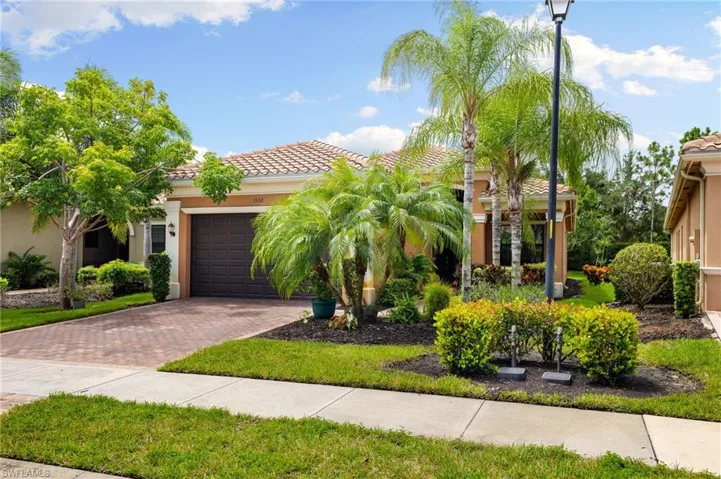 Mediterranean / spanish house with a garage
