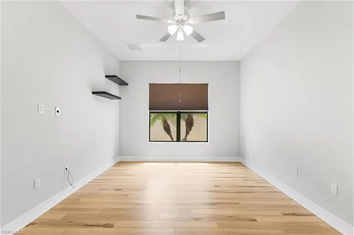 Spare room featuring light hardwood / wood-style flooring and ceiling fan
