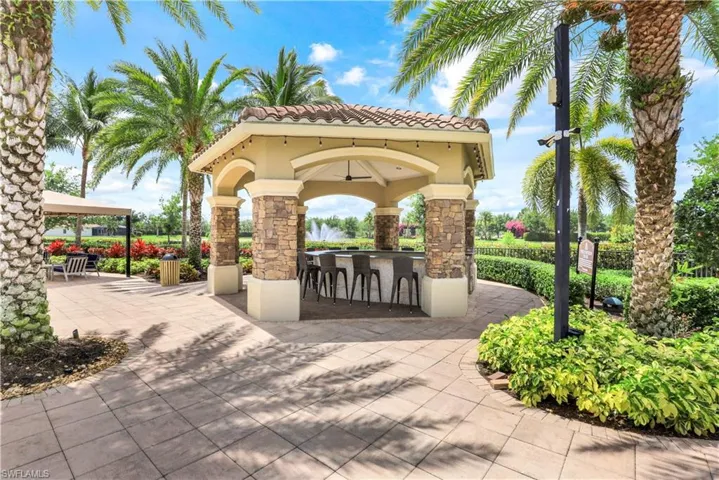 View of property's community with an outdoor bar, a patio area, a gazebo, and exterior kitchen
