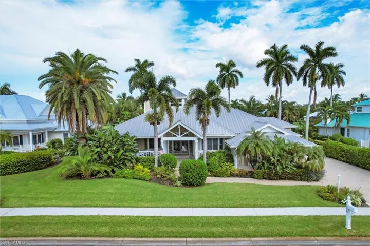 View of front facade with lanscaped lawn