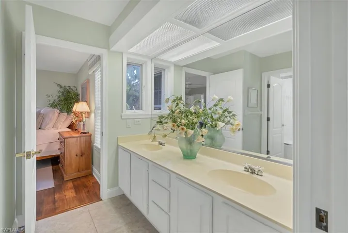 Bathroom with vanity and hardwood / wood-style floors