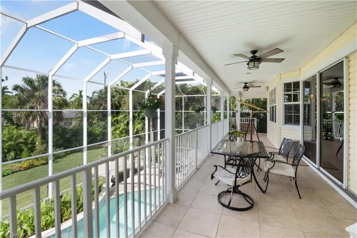 Sunroom featuring ceiling fan