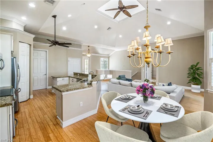 Virtual staged kitchen overlooking living area