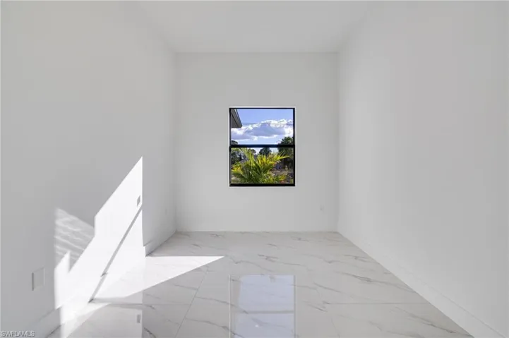 Empty room with baseboards and light marble finish flooring