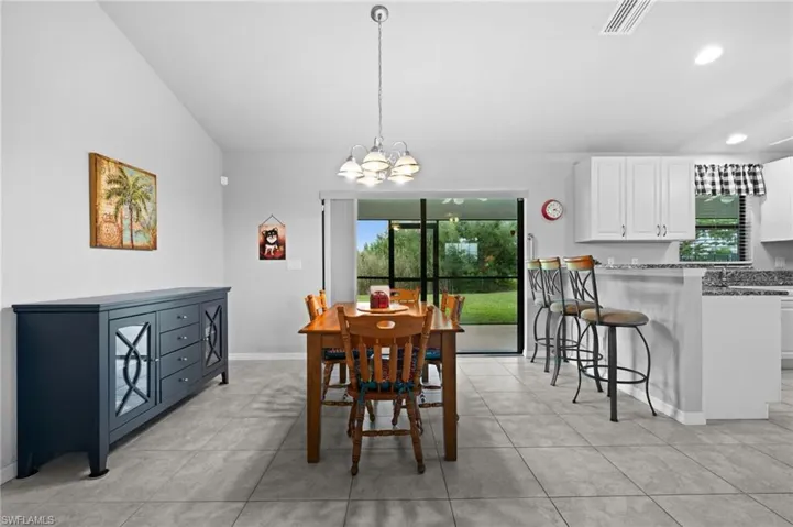 Dining room with a sliding door to the screened, covered porch