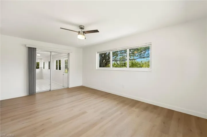 Spare room with light wood-type flooring and a ceiling fan