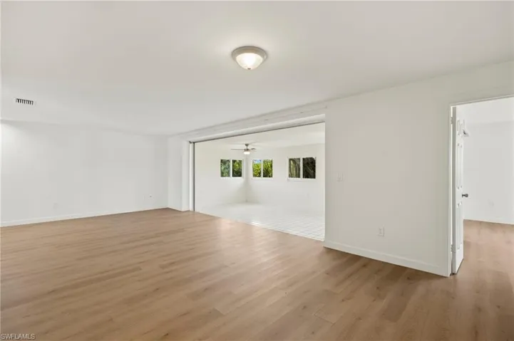 Spare room featuring light wood-style floors and ceiling fan