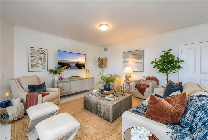 Living area featuring crown molding