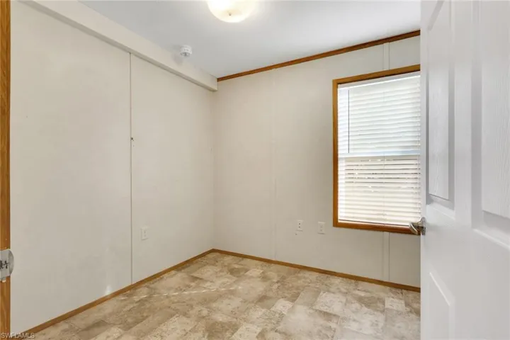 Unfurnished room featuring crown molding