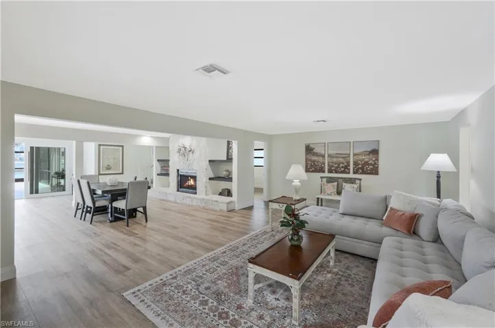 Living area featuring a fireplace and wood finished floors