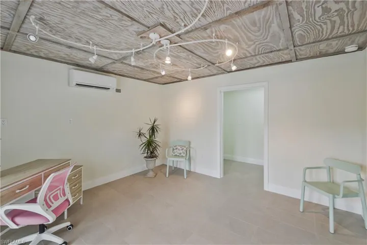Home office with a mini split for heating / cooling and baseboards