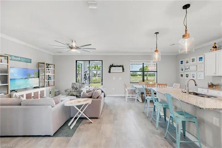 Open concept living and dining area with upgrade ceramic tile.