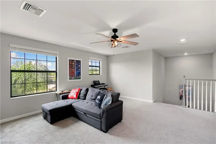 Bonus Room with ceiling fan and lots of natural light.