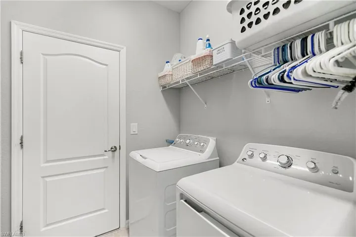 Laundry area that leads to the garage.